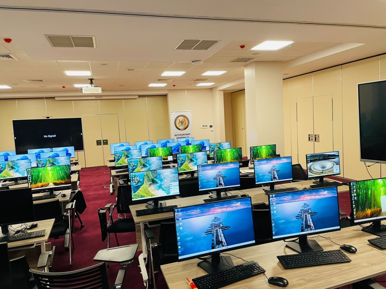 Rows of monitors, keyboards and workstations installed by TPCL for the Ministry of Finance