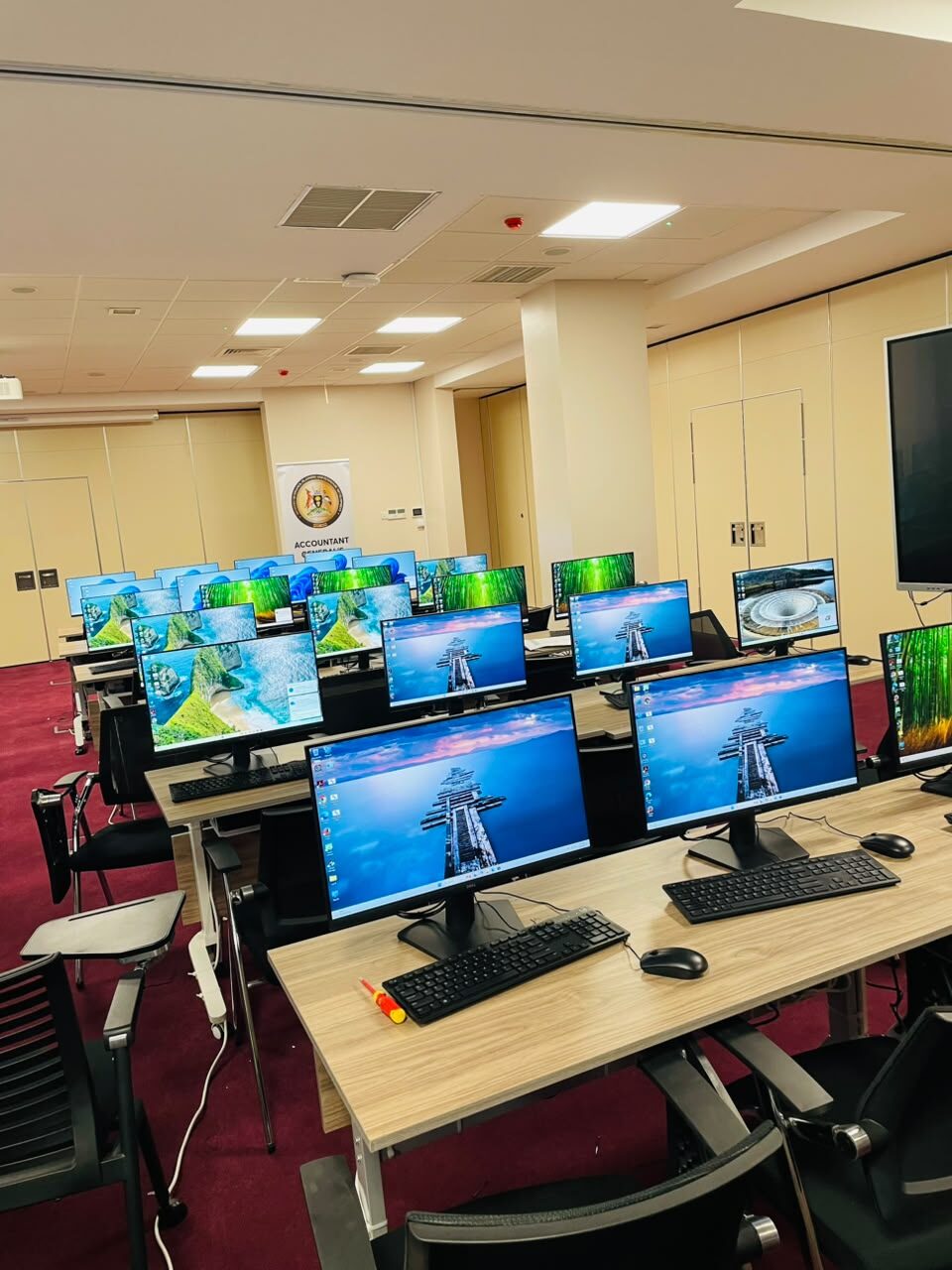 Installed monitors and workstations in a Ministry of Finance training room