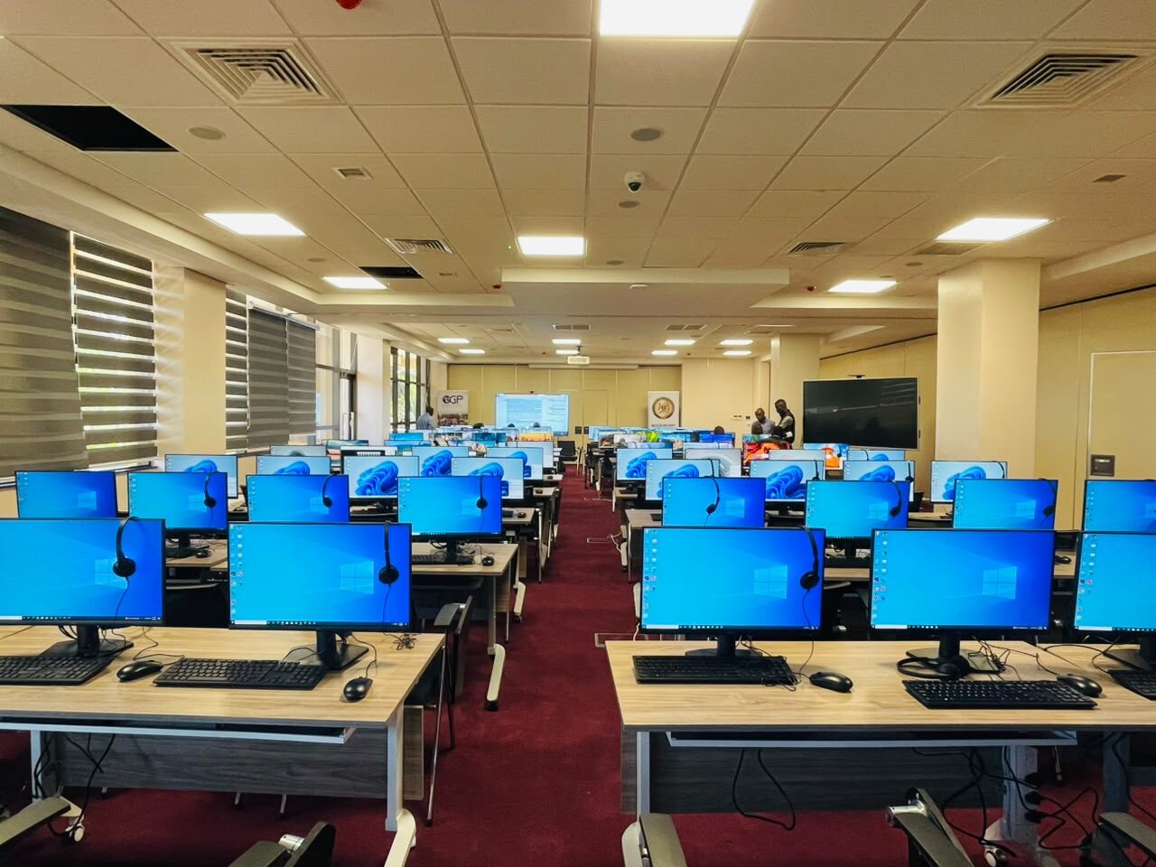 Workstations with monitors and headsets installed by TPCL for the Ministry of Finance